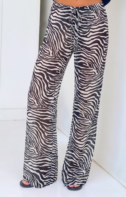 Pantalones negros transparentes con estampado de cebra Joplin - PRE-ORDEN